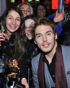 I had to post this photo that I found on a Gossip Site... it is of me photobombing two teenaged girls photo with Sam Claflin. Hilarious.